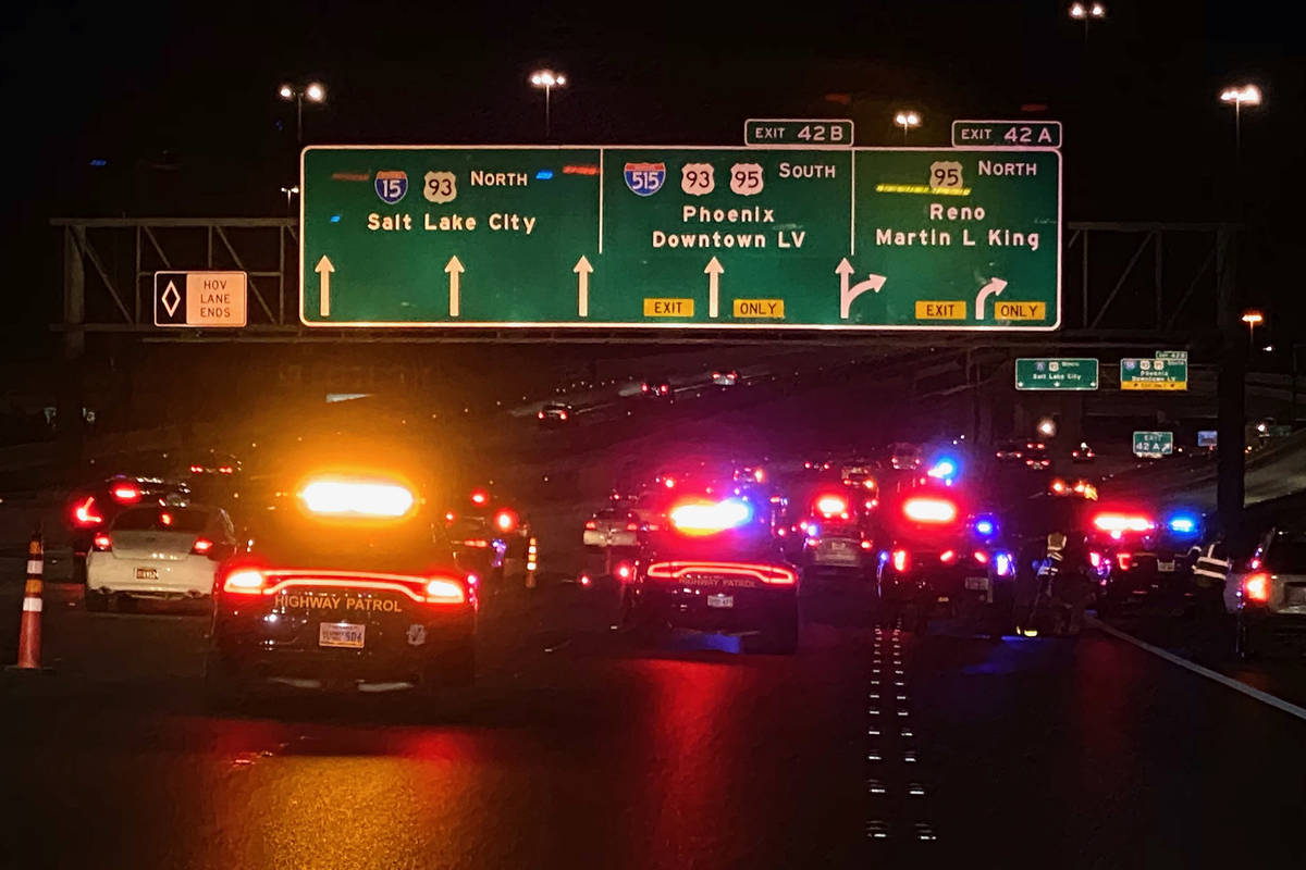 The Nevada Highway Patrol blocks part of northbound Interstate 15 near downtown Las Vegas on Su ...