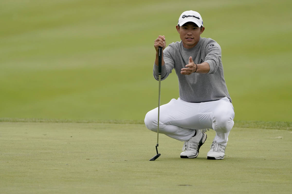 Collin Morikawa looks over his shot on the 18th green during the final round of the PGA Champio ...