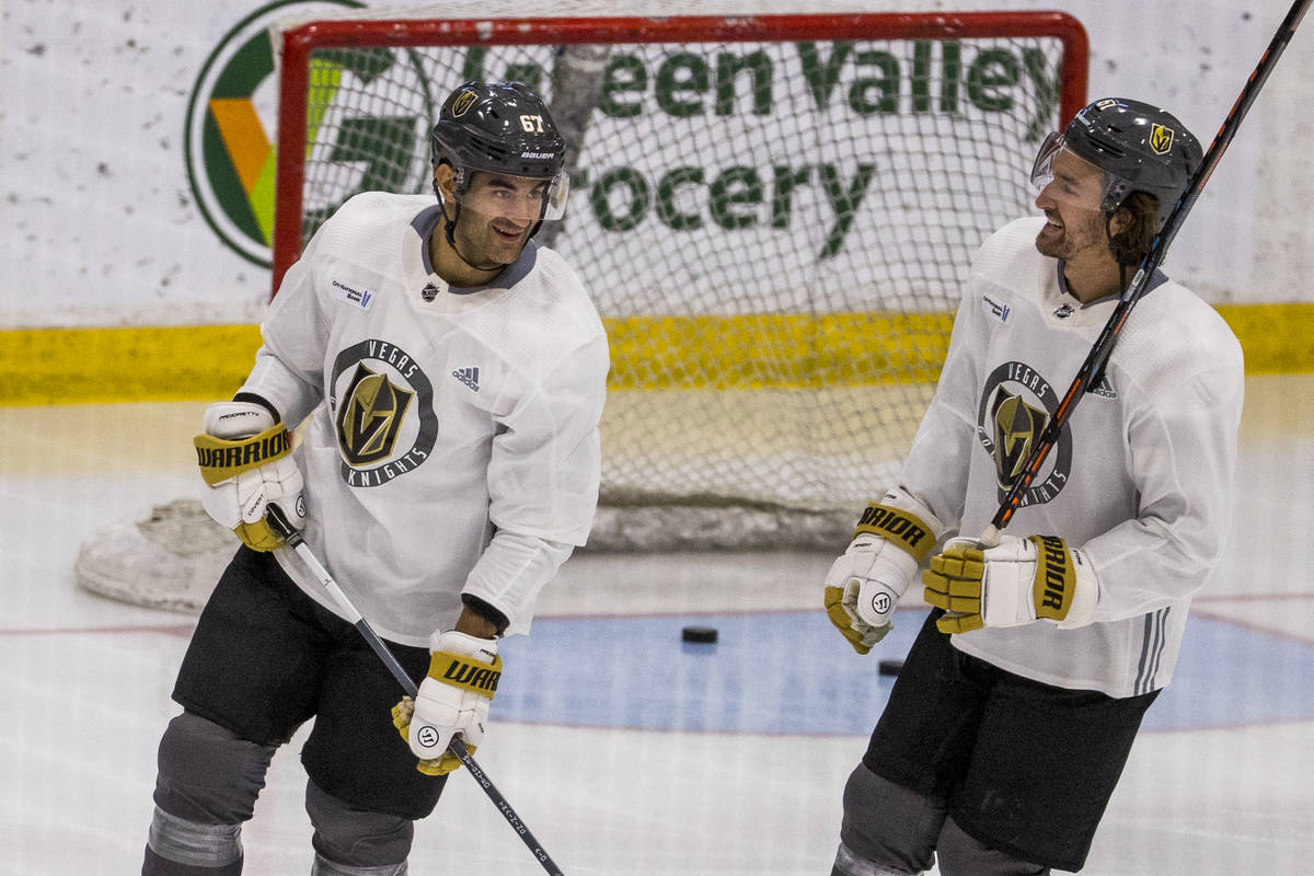 Vegas Golden Knights left wing Max Pacioretty (67, left) talks with right wing Mark Stone (61) ...