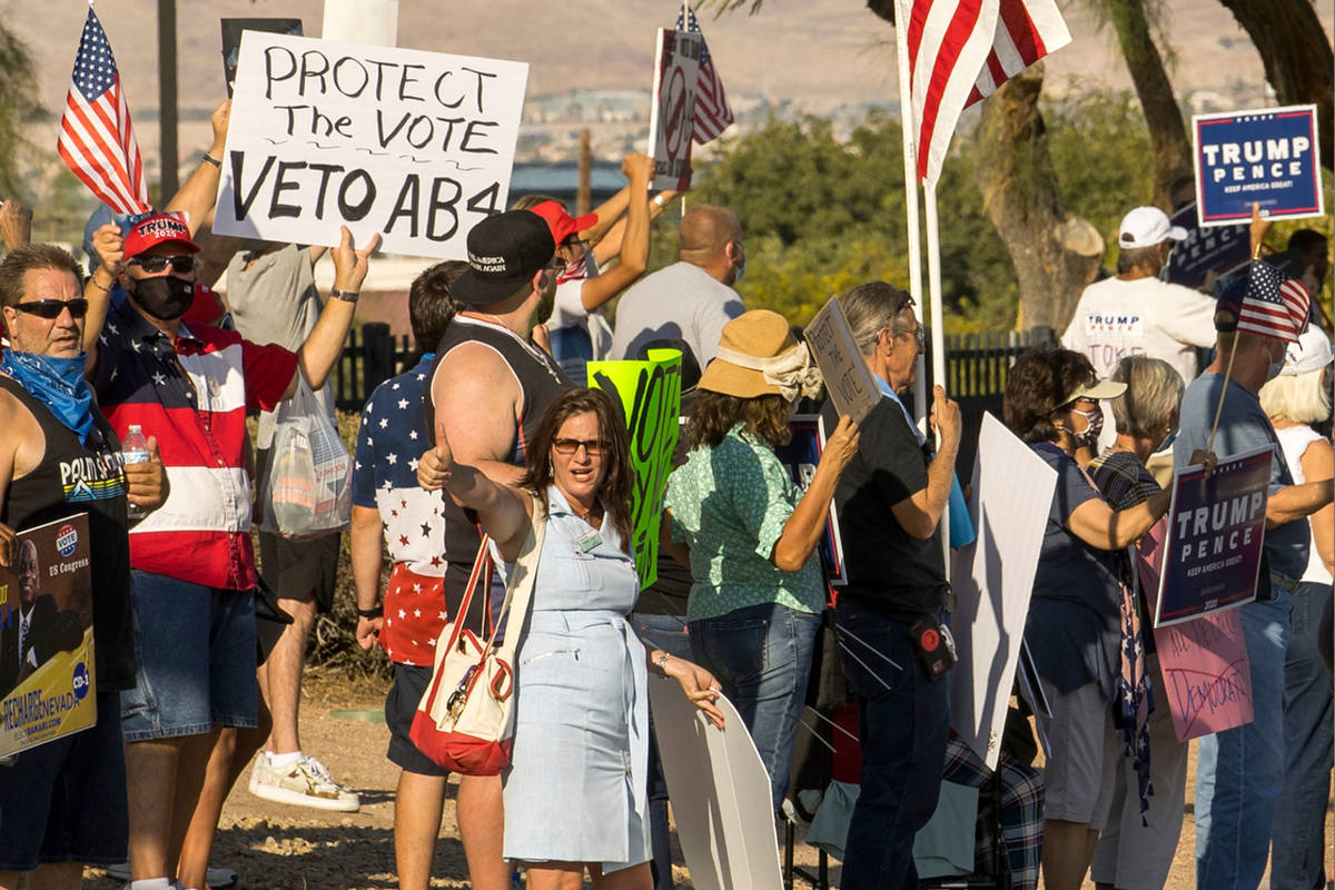 Protesters rally outside the Grant Sawyer building to voice opposition against AB4, a controver ...