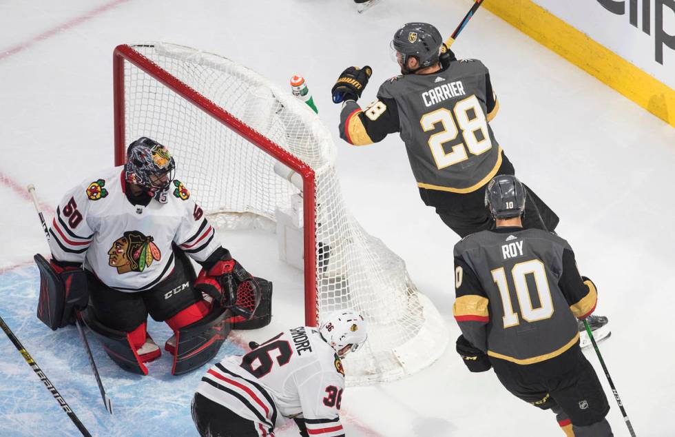 Chicago Blackhawks goalie Corey Crawford (50) looks back after a goaly by Vegas Golden Knights' ...