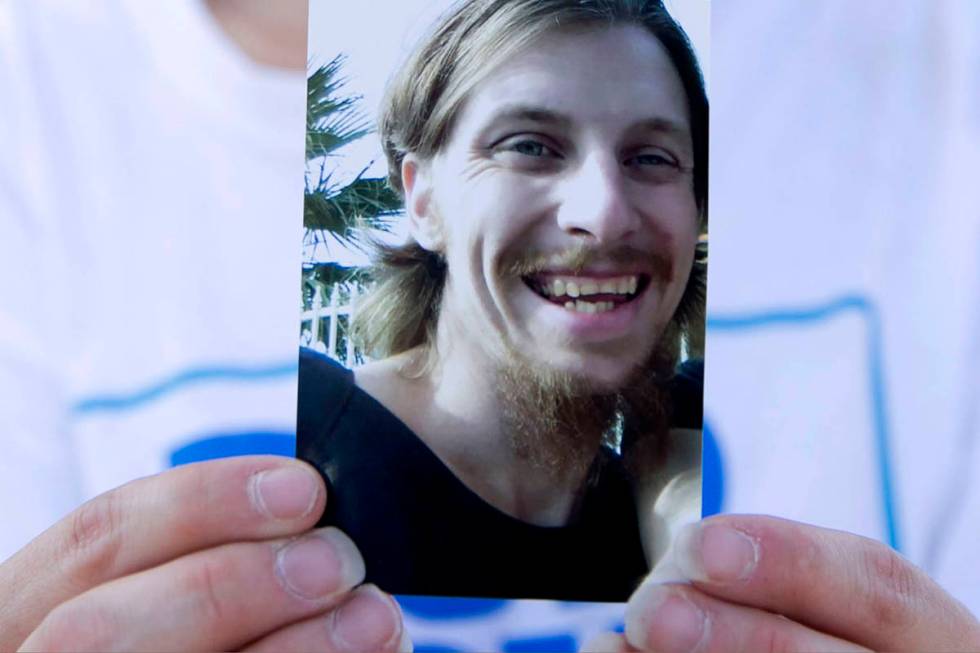 Samantha Squires holds a photograph of her brother, Joshua, at the Storeyville Manufactured Hom ...