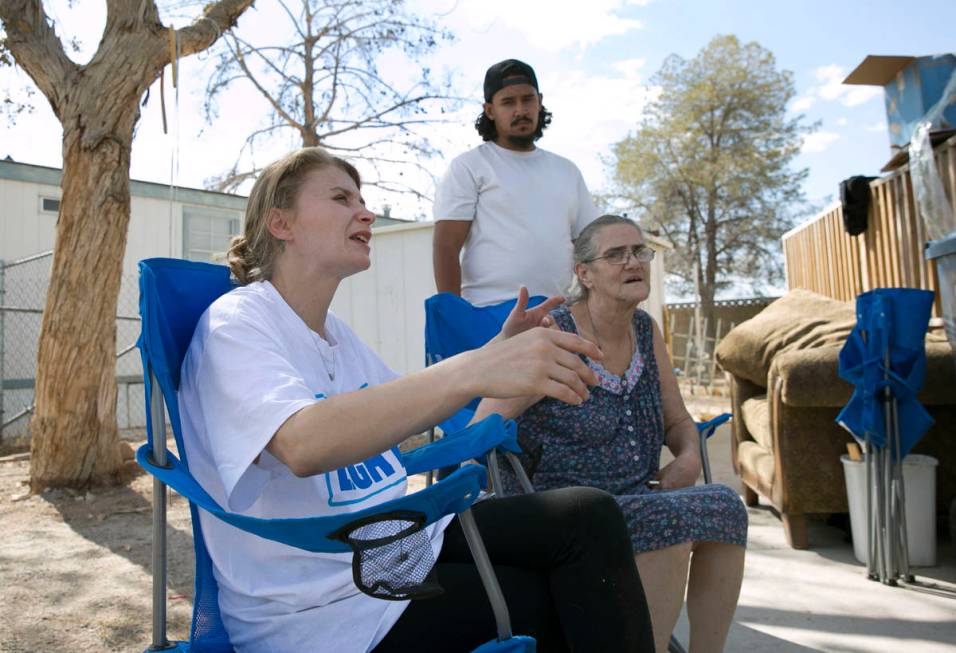 Samantha Squires, left, speaks about her brother, Joshua, who was killed by police after he hel ...