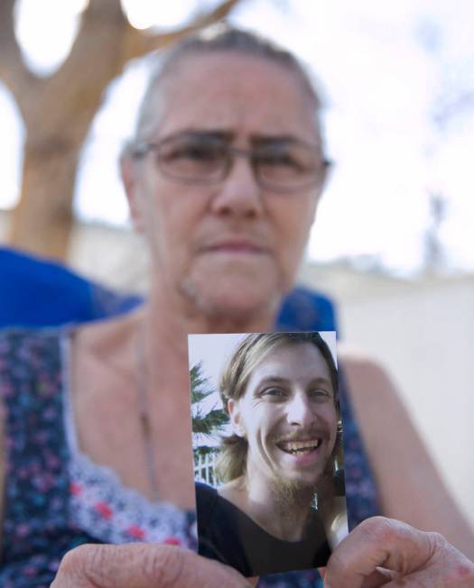 Toni Squires holds a photograph of her son, Joshua, at the Storeyville Manufactured Home Commun ...