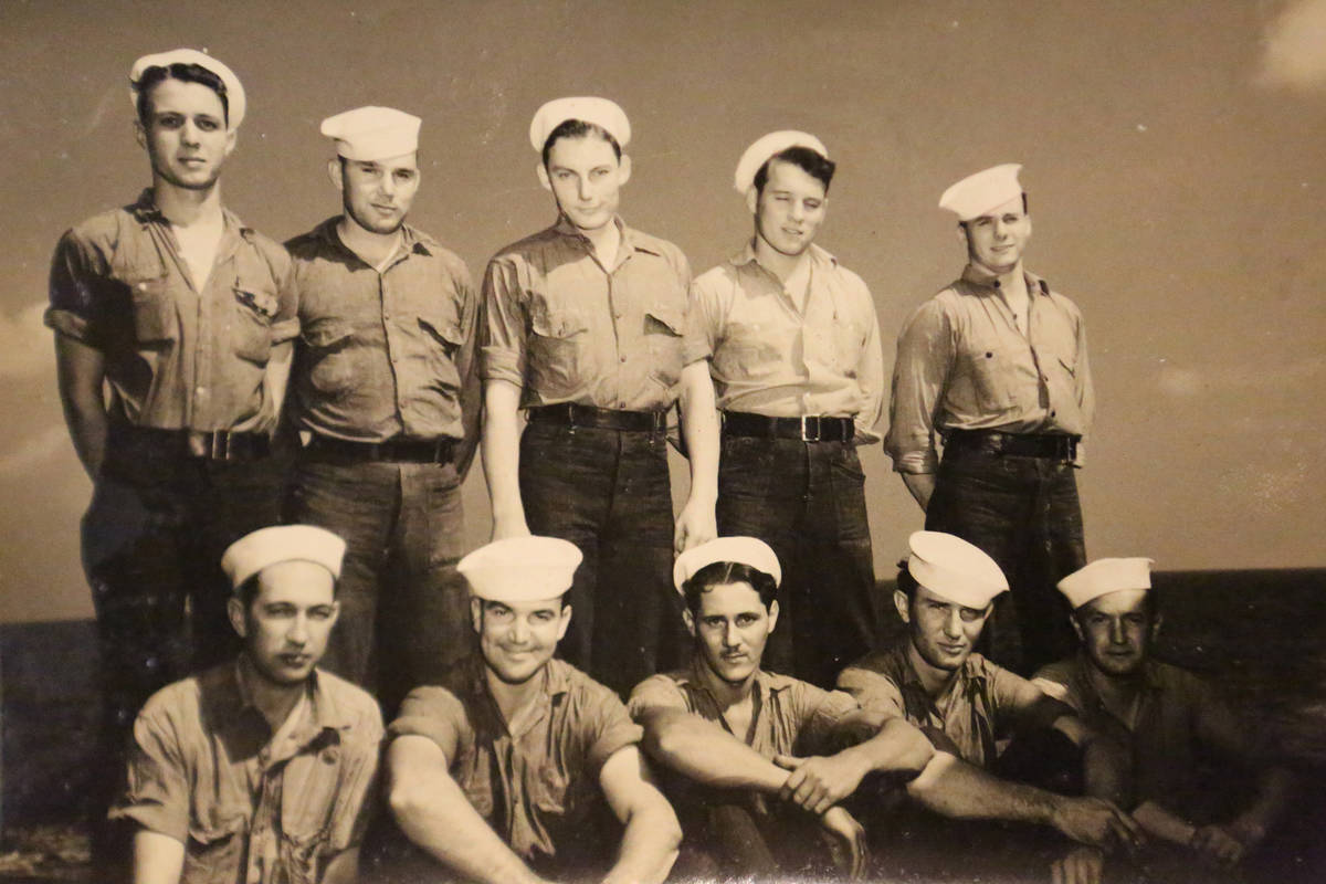 Pearl Harbor Survivor, Lenoard Nielsen, top row, fourth from left, poses for a snapshot with cr ...