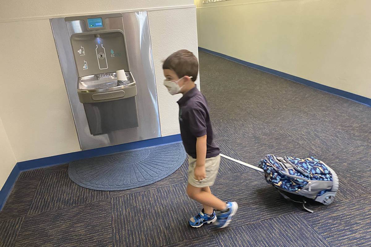 A student arrives on the first day of school Wednesday, Aug. 12, 2020 at the Dr. Miriam & Sheld ...