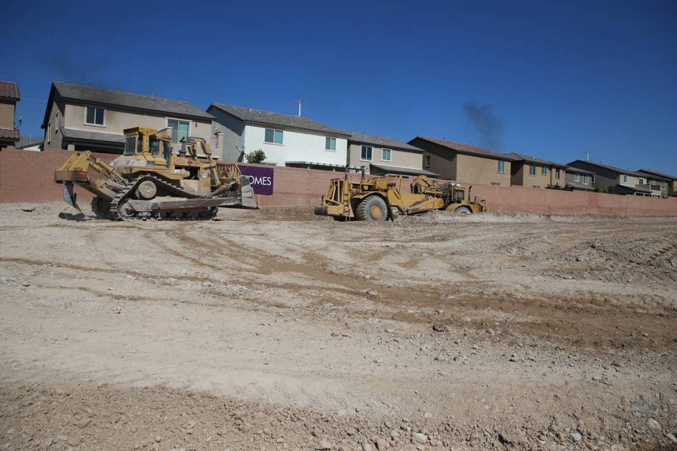 The construction site of the townhouse project Brownstones at Providence by Edward Homes in Las ...