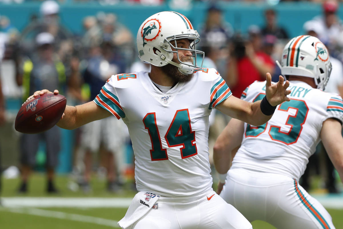 FILE - In this Sept. 15, 2019, file photo, Miami Dolphins quarterback Ryan Fitzpatrick (14) loo ...