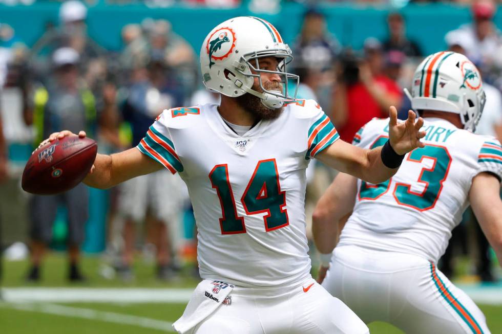 FILE - In this Sept. 15, 2019, file photo, Miami Dolphins quarterback Ryan Fitzpatrick (14) loo ...