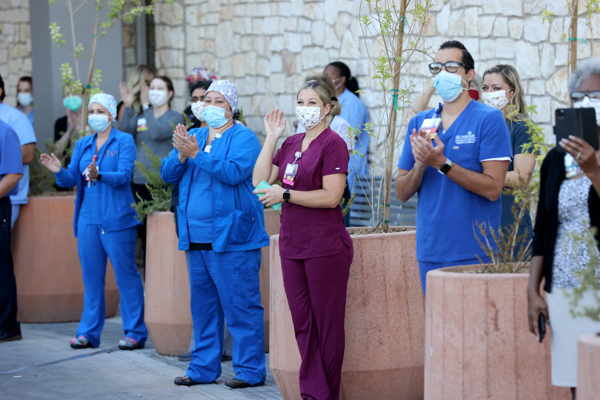 Medical professionals at Sunrise Hospital and Medical Center in Las Vegas, watch a #MaskUpNV sh ...