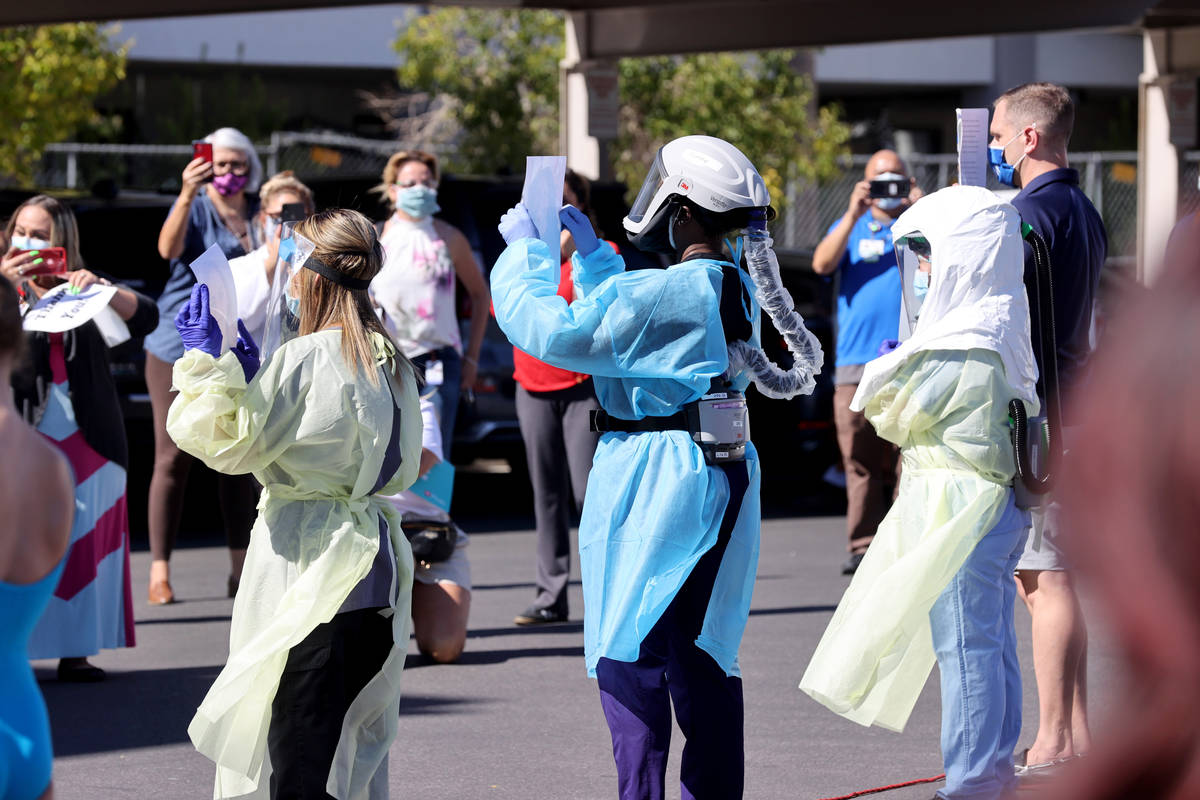 Medical professionals at Valley Hospital Medical Center in Las Vegas, during a #MaskUpNV show a ...
