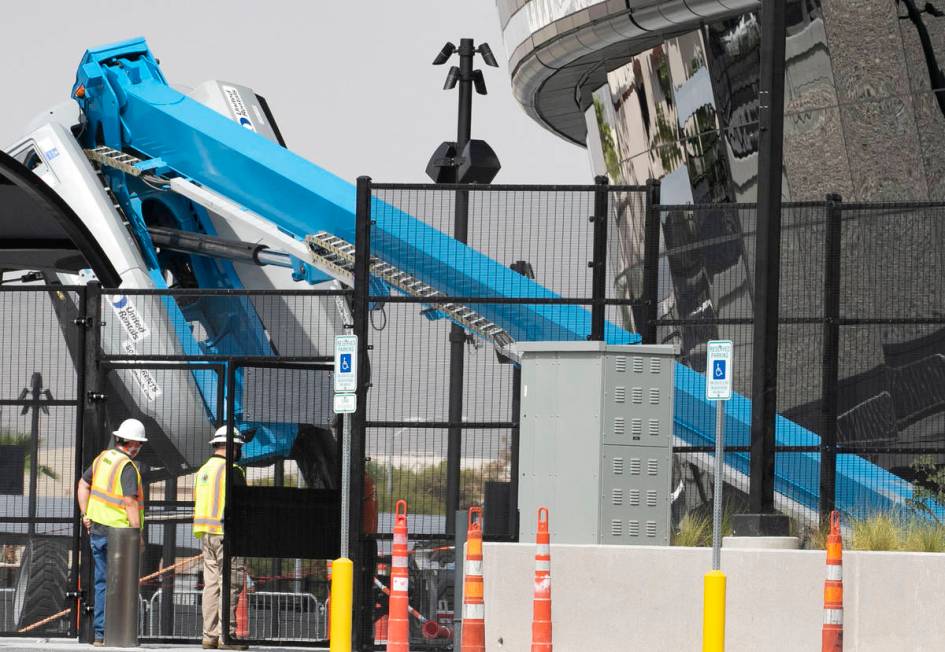 A boom lift lays on its side on the exterior of Allegiant Stadium in Las Vegas on Thursday, Aug ...