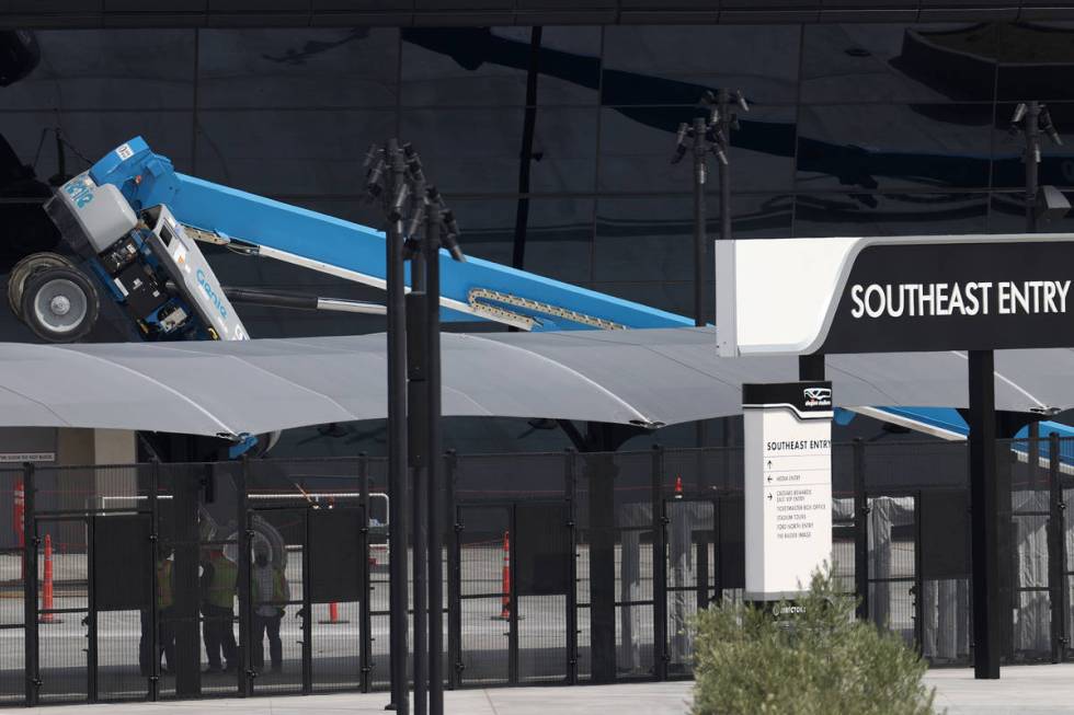 A boom lift lays on its side on the exterior of Allegiant Stadium in Las Vegas, Thursday, Aug. ...