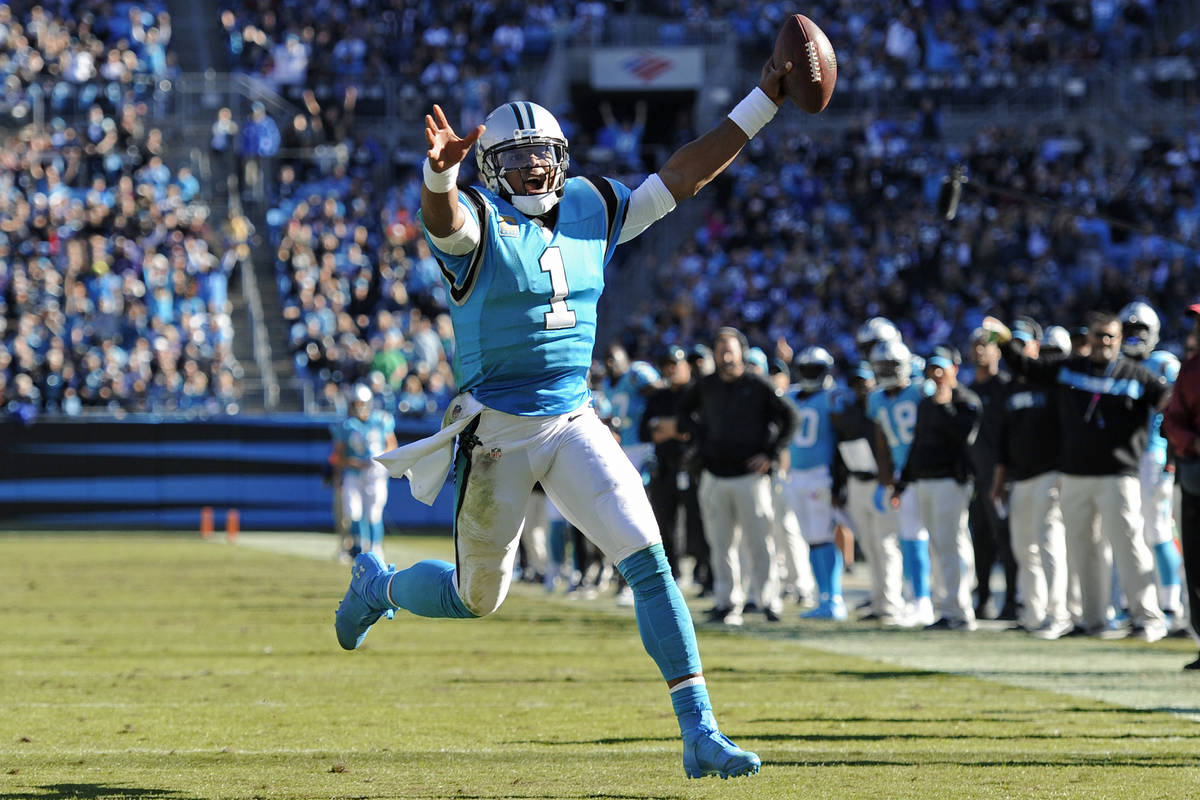 Carolina Panthers' Cam Newton (1) runs for a touchdown against the Baltimore Ravens in the seco ...