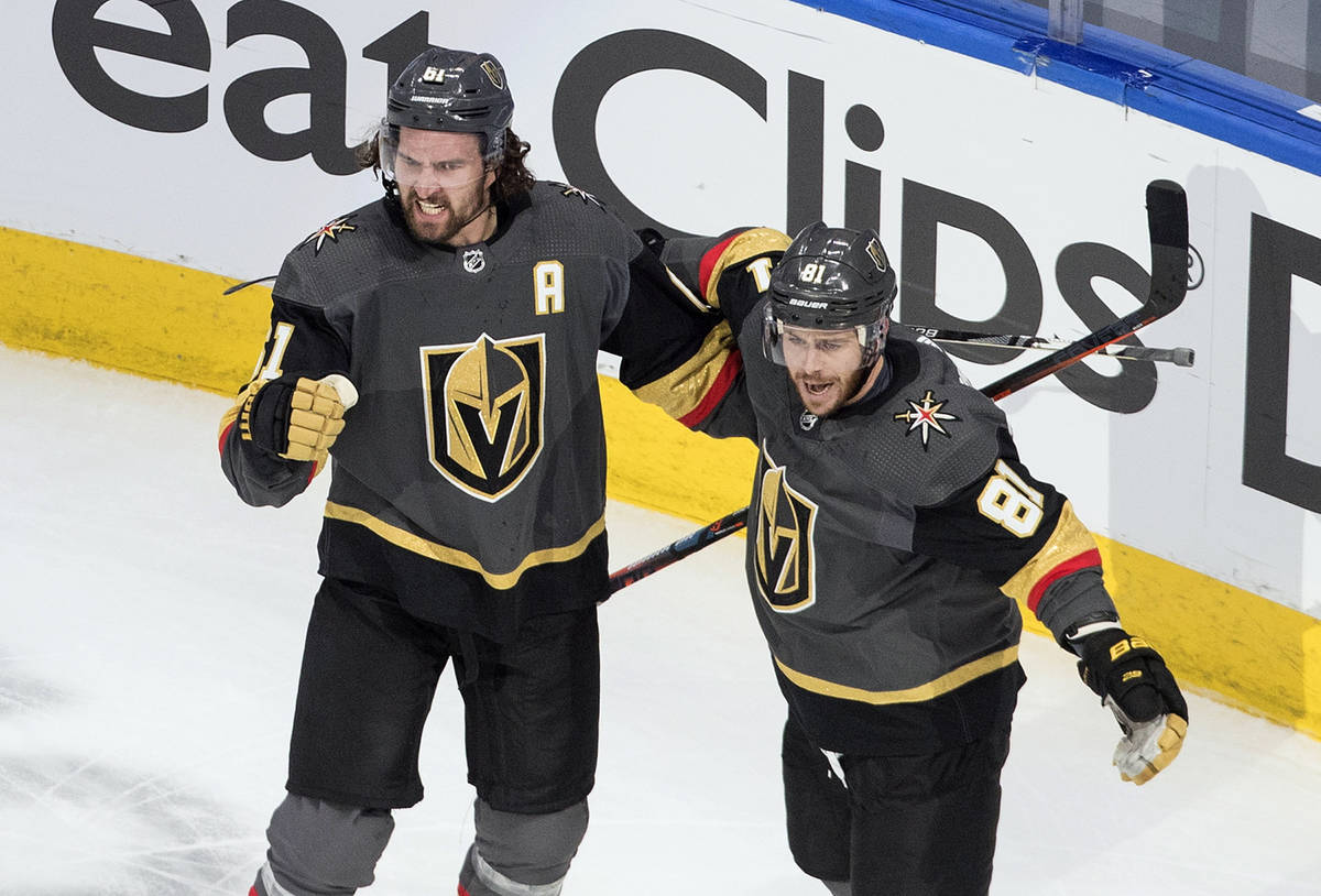 Vegas Golden Knights' Mark Stone (61) and Jonathan Marchessault (81) celebrate a goal against t ...