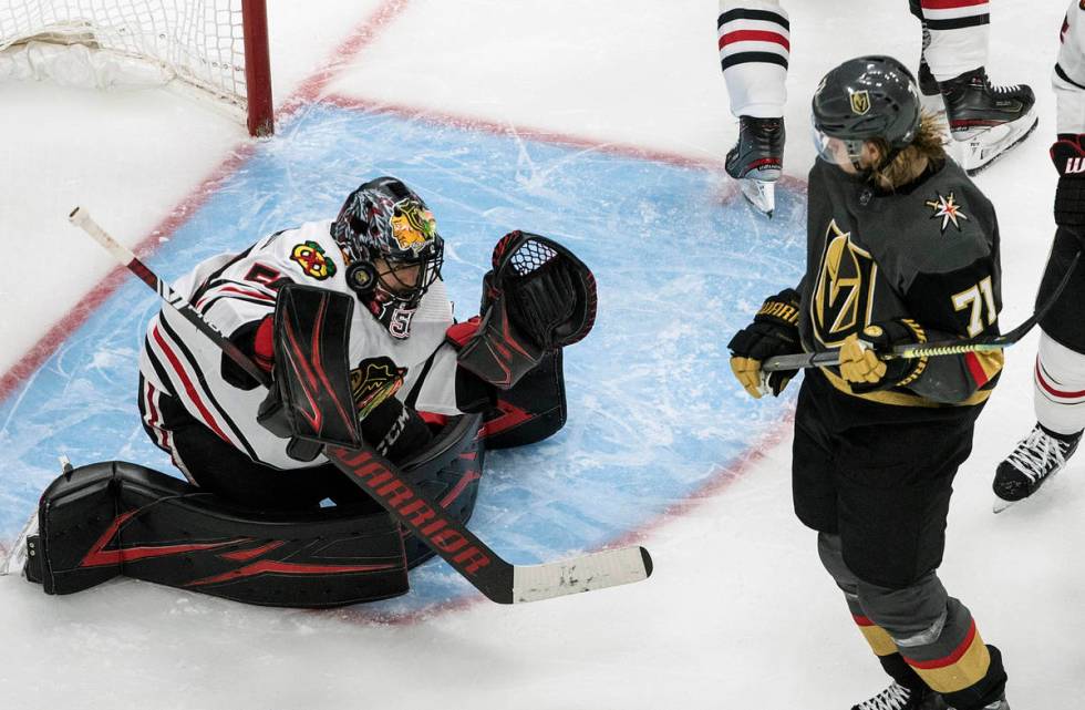 Vegas Golden Knights' William Karlsson (71)watches as Chicago Blackhawks goalie Corey Crawford ...