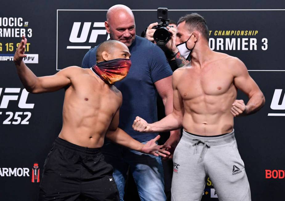 (L-R) Opponents John Dodson and Merab Dvalishvili of Georgia face off during the UFC 252 weigh- ...