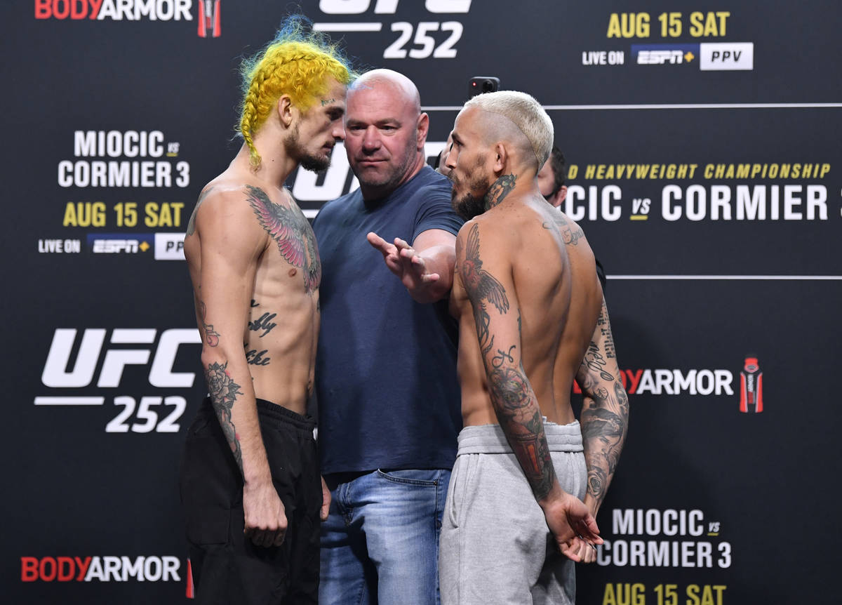 (L-R) Opponents Sean O'Malley and Marlon Vera of Ecuador face off during the UFC 252 weigh-in a ...
