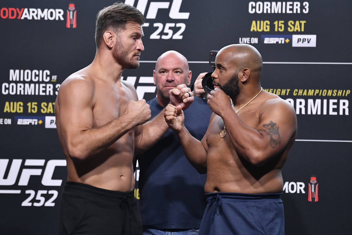 (L-R) Opponents Stipe Miocic and Daniel Cormier face off during the UFC 252 weigh-in at UFC APE ...