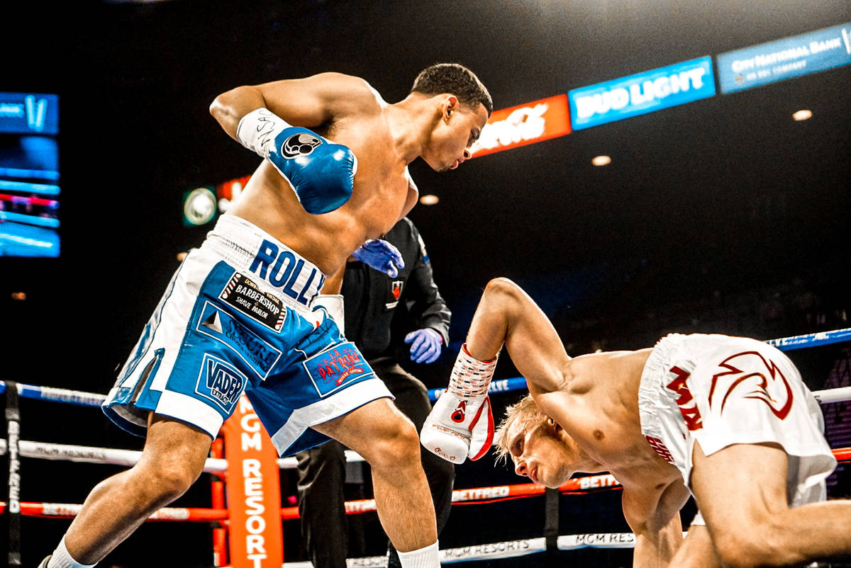 Lightweight boxer and Las Vegas native Rolando Romero (left) fights Arturs Ahmetovs at MGM Gran ...