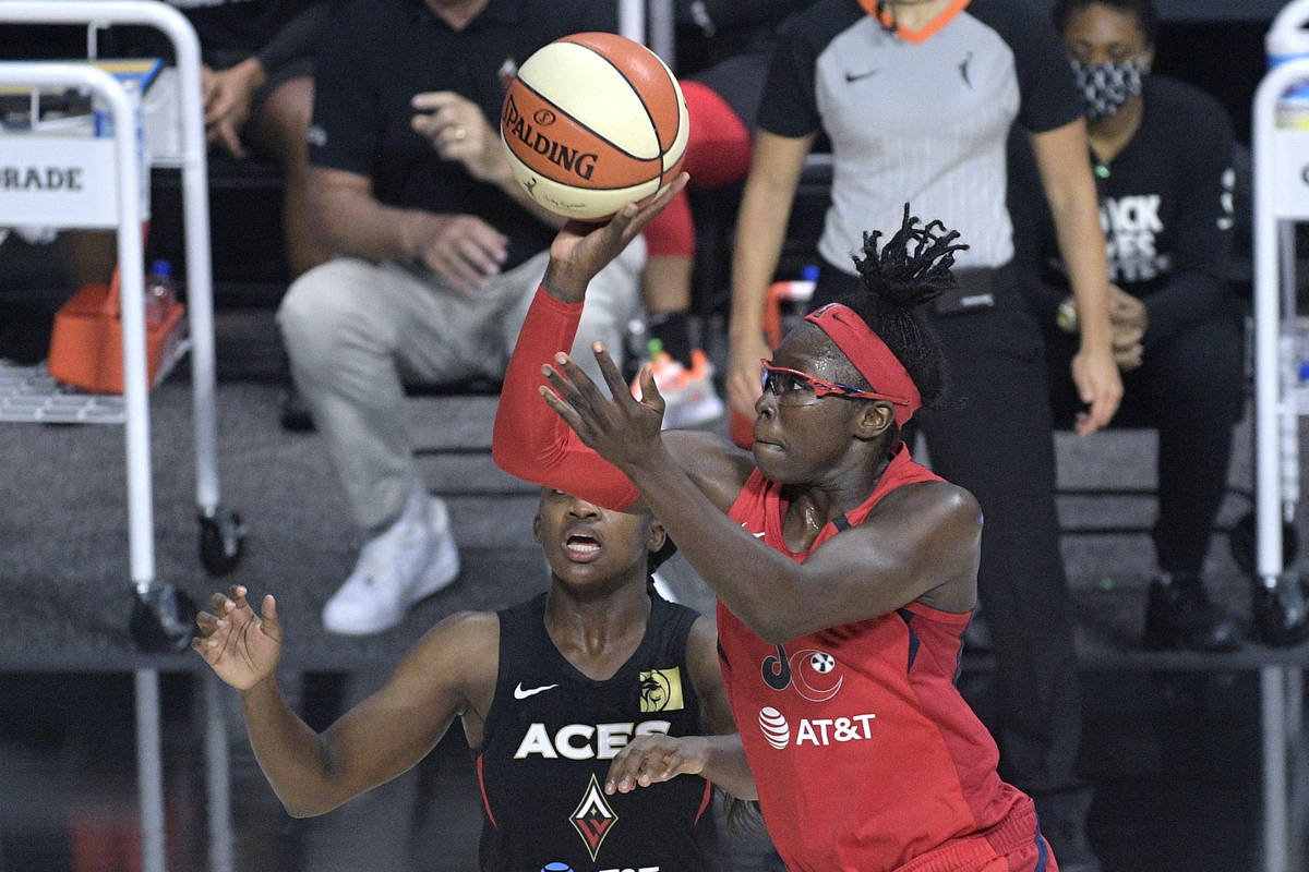 Washington Mystics forward Essence Carson, goes up for a shot in front of Las Vegas Aces guard ...