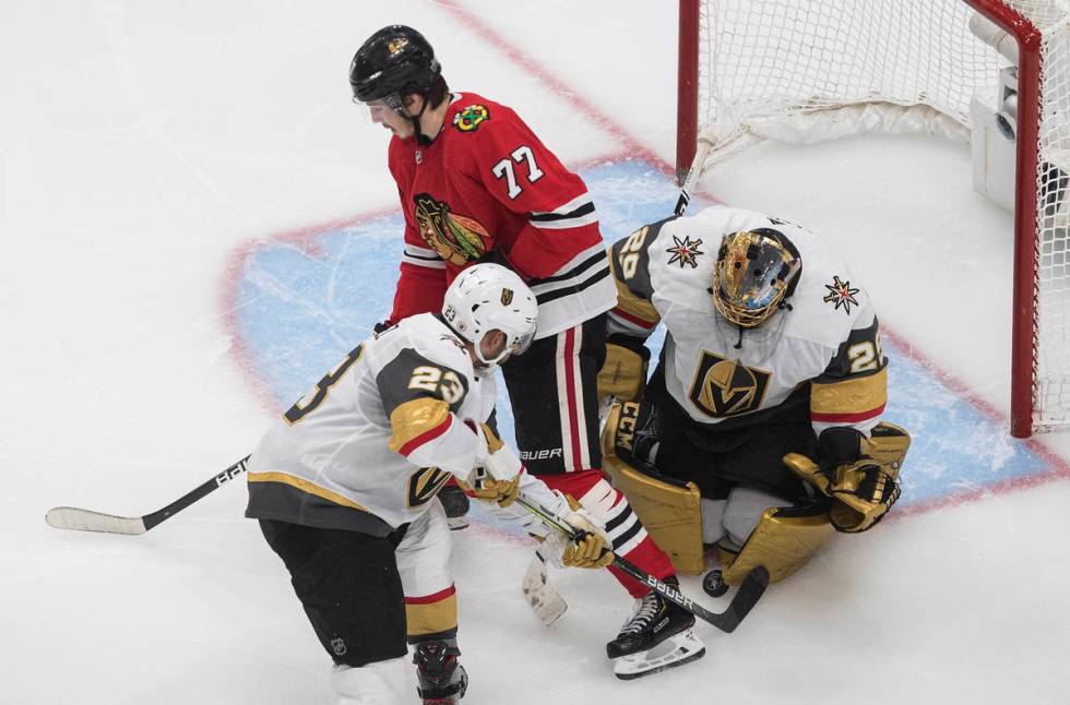 Vegas Golden Knights goalie Marc-Andre Fleury (29) makes a save as Chicago Blackhawks' Kirby Da ...