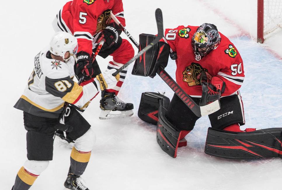 Vegas Golden Knights' Jonathan Marchessault (81) is stopped by Chicago Blackhawks goalie Corey ...