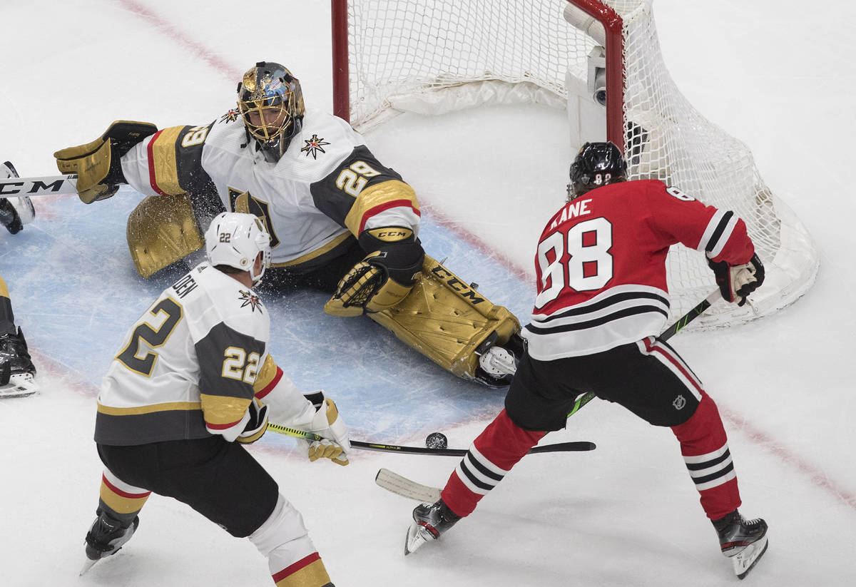 Vegas Golden Knights goalie Marc-Andre Fleury (29) makes a save on Chicago Blackhawks' Patrick ...