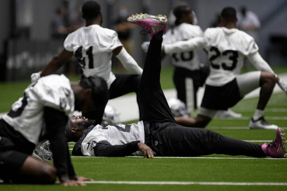 Raiders defensive back Trayvon Mullen (27) stretches during an NFL football training camp pract ...