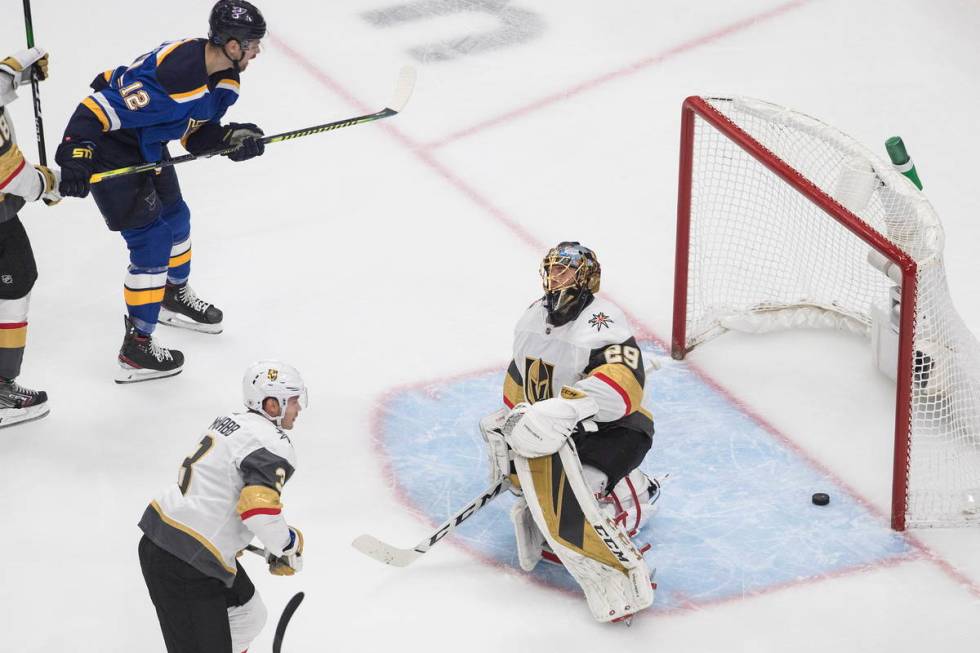 St. Louis Blues' Zach Sanford (12) watches the puck go past Vegas Golden Knights goalie Marc-An ...