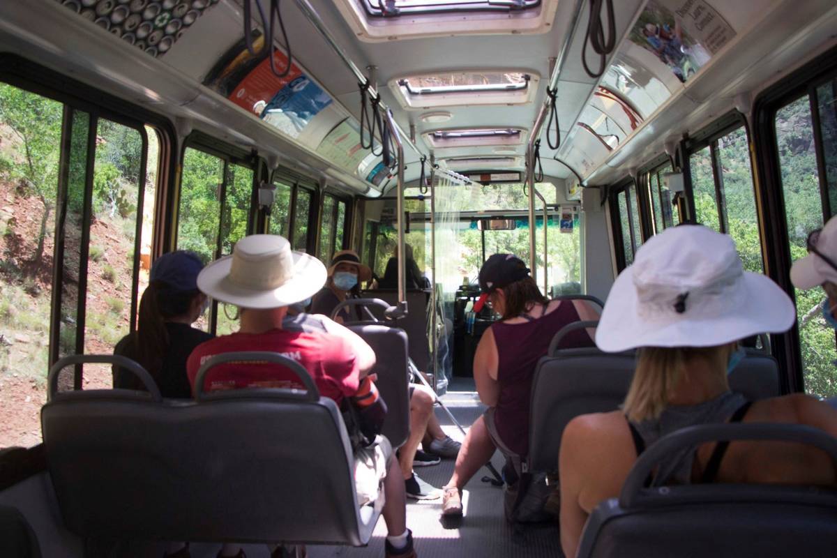 A visitors to Zion National Park, Utah ride a shuttle bus on Wednesday, July 1, 2020. Now two d ...