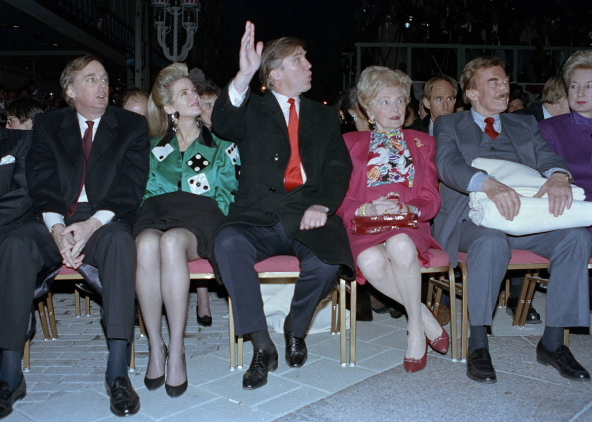 FILE - In this April 5, 1990, file photo, Donald Trump waves to staff members of the Trump Taj ...