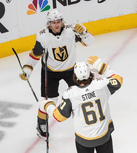 Vegas Golden Knights' William Karlsson (71) and Mark Stone (61) celebrate a goal against the Ch ...