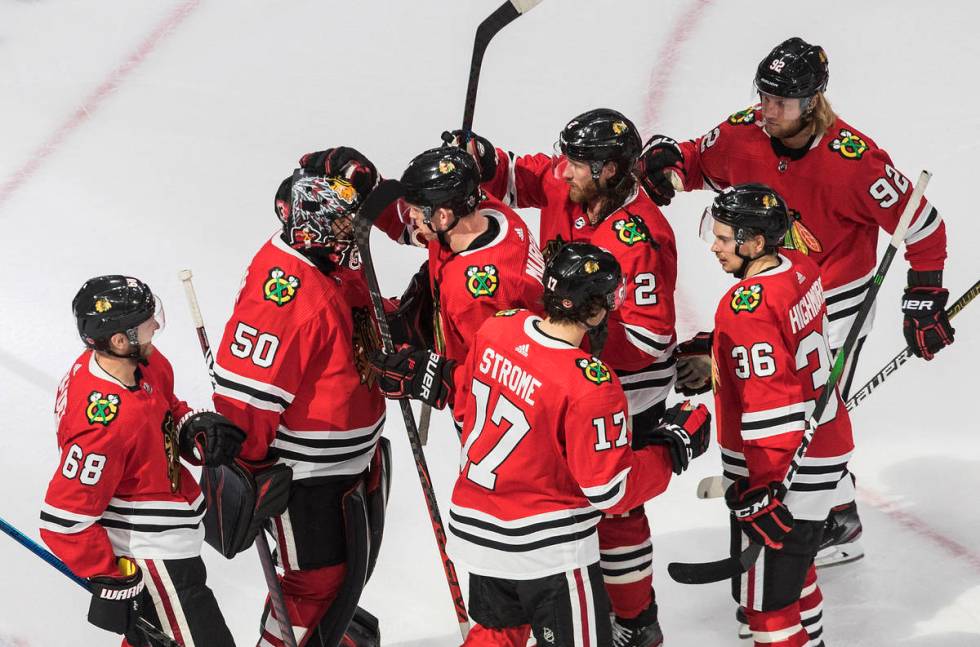 Chicago Blackhawks goalie Corey Crawford (50) and teammates celebrate a win over the Vegas Gold ...