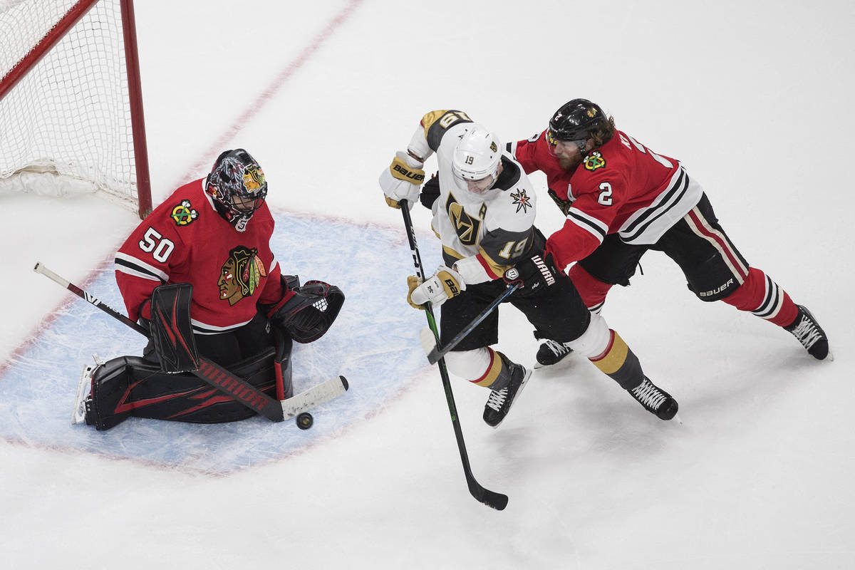 Vegas Golden Knights' Reilly Smith (19) is stopped by Chicago Blackhawks goalie Corey Crawford ...