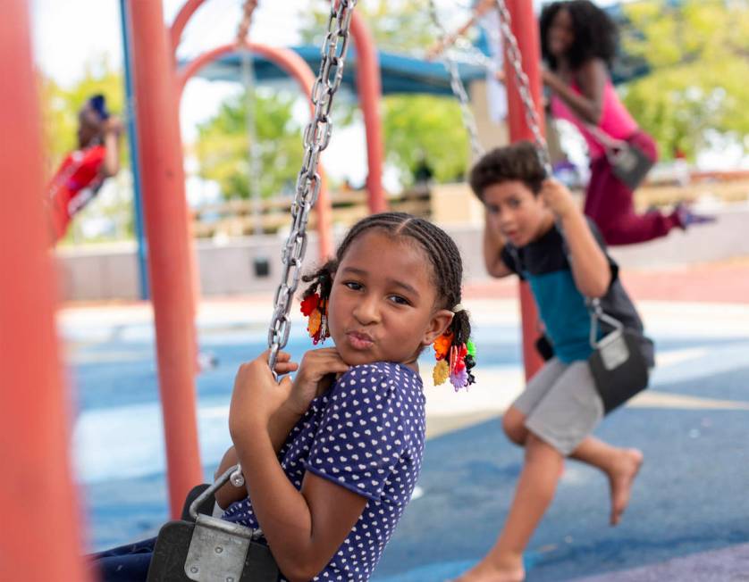 Akailyn Richardson, 8, swings after her family participated in an outdoor church service at Kel ...