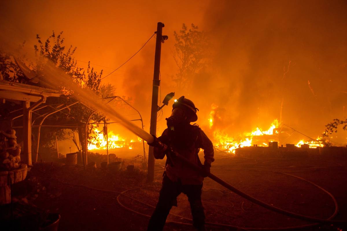 FILE - In this Aug. 12, 2020, file photo, a firefighter works against the Lake Hughes Fire in A ...