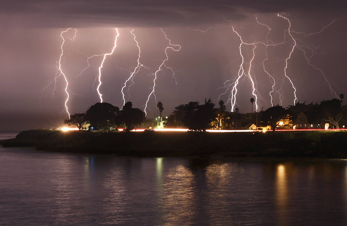 A rare lightning storm crackles over Mitchell's Cove in Santa Cruz, California around 3 a.m. Su ...