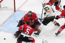 Vegas Golden Knights' Nicolas Roy (10) is stopped by Chicago Blackhawks goalie Corey Crawford ( ...