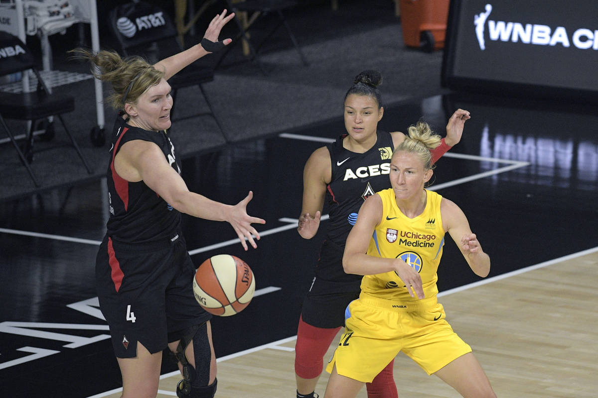 Chicago Sky guard Courtney Vandersloot (22) passes the ball in front of Las Vegas Aces center C ...