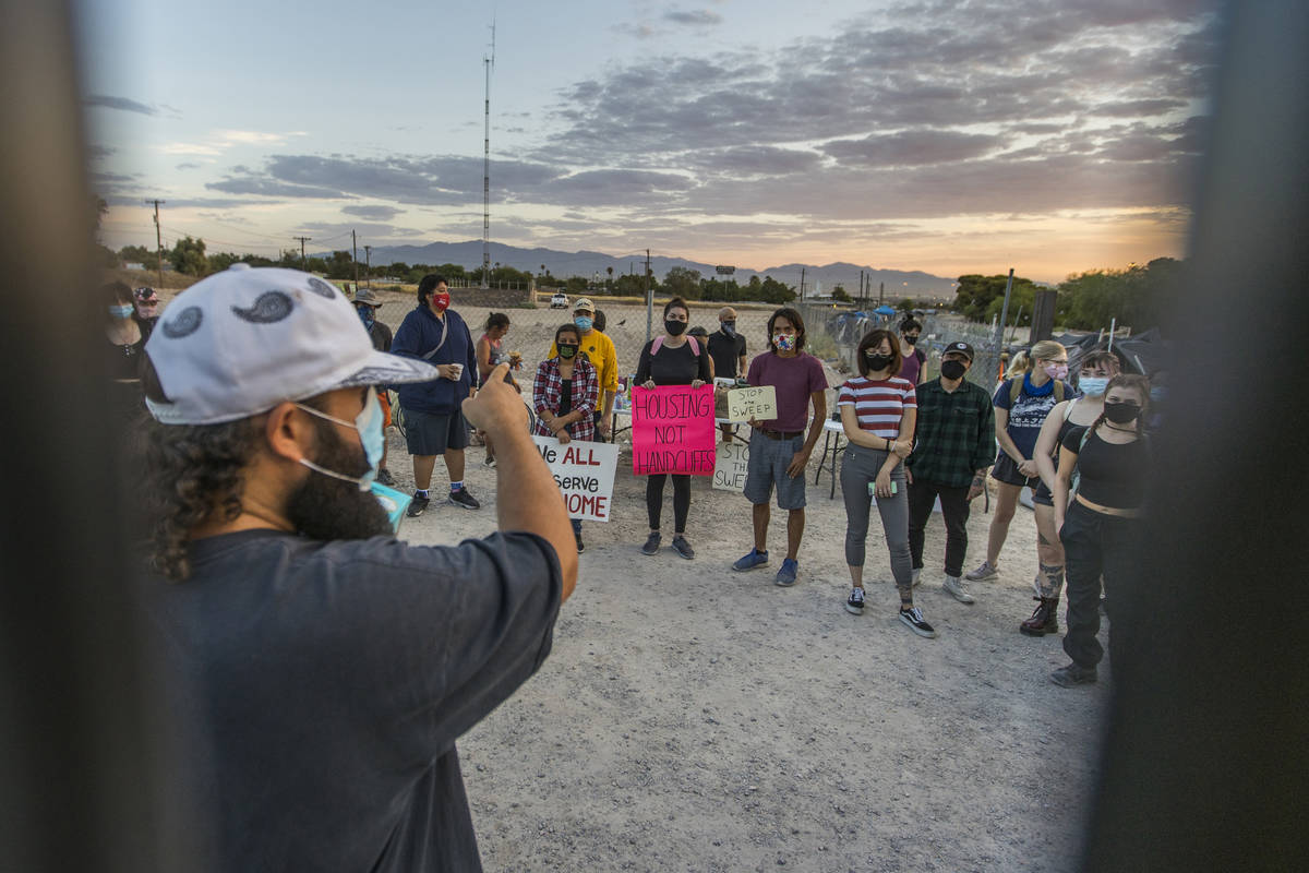 Joey Lankowski, near, organizes members of Food Not Bombs, the Sidewalk Project and other suppo ...