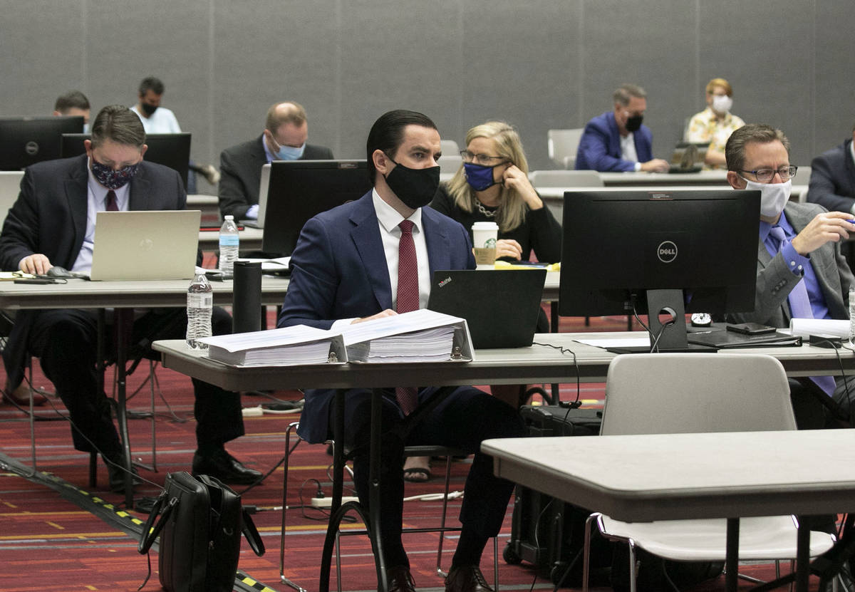 Attorneys in the trial of marijuana dispensaries license listen during a closing argument at th ...