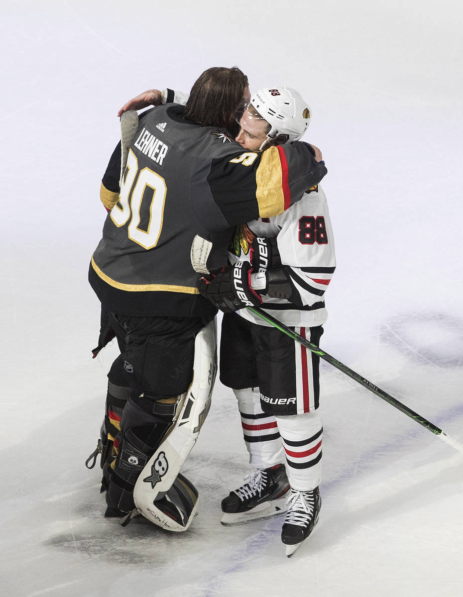 Vegas Golden Knights goalie Robin Lehner (90) and Chicago Blackhawks' Patrick Kane (88) hug aft ...