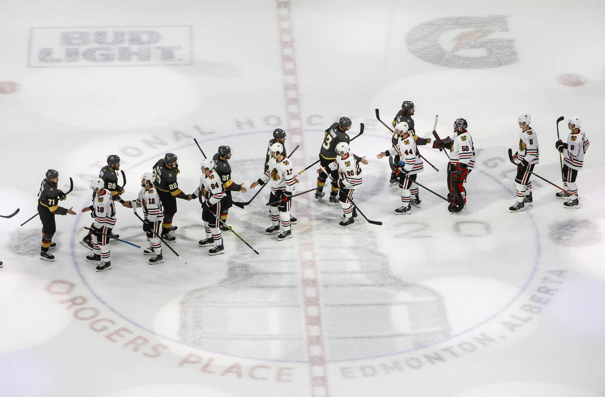 Vegas Golden Knights and Chicago Blackhawks shake hands after the Blackhawks lost to the Golden ...