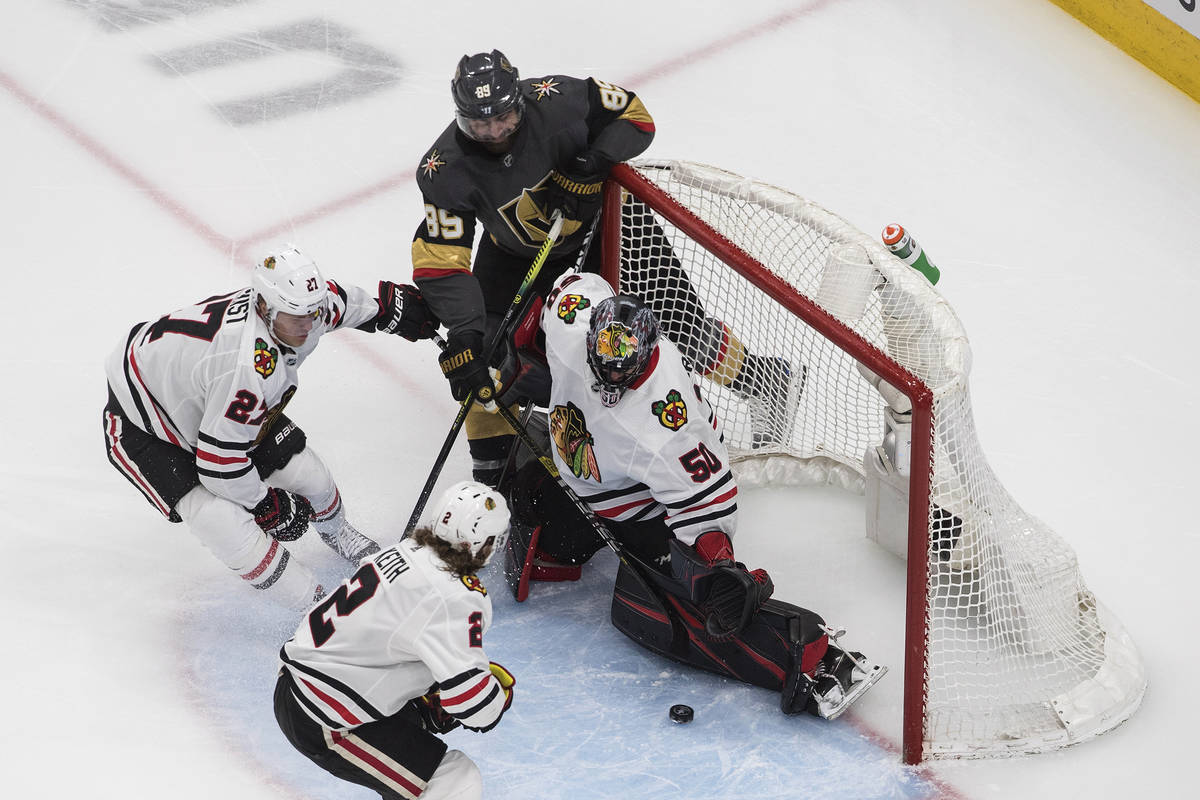 Vegas Golden Knights' Alex Tuch (89) scores on Chicago Blackhawks' goalie Corey Crawford (50) a ...