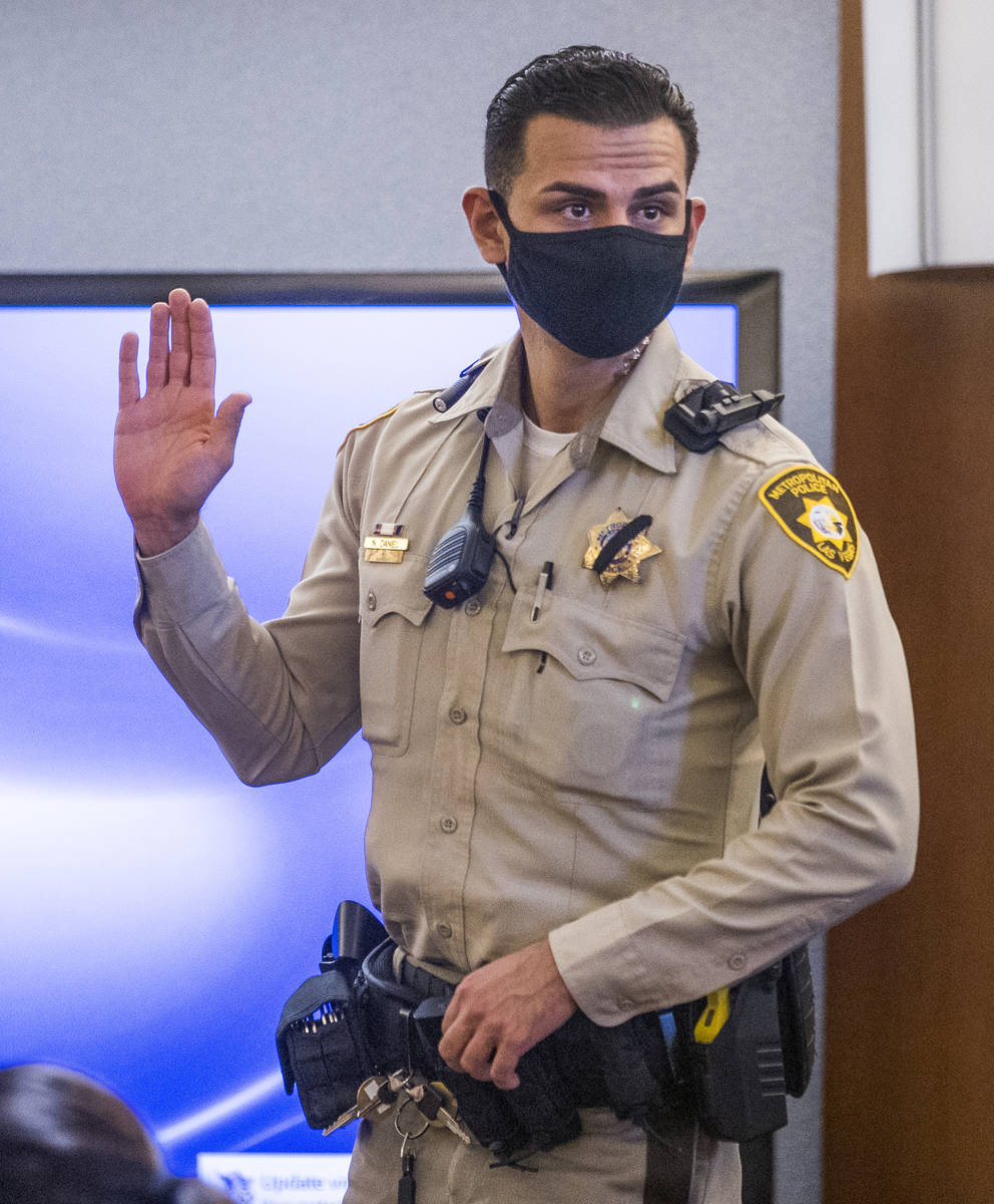 Metro officer Nolan Daniel is sworn in as a witness during a preliminary hearing for Adolfo Oro ...