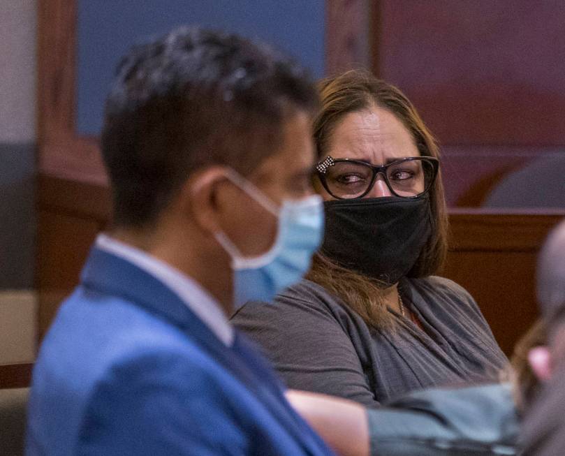 Defendant Malinda Mier, right, cries in court while viewing photos of victims during a prelimin ...