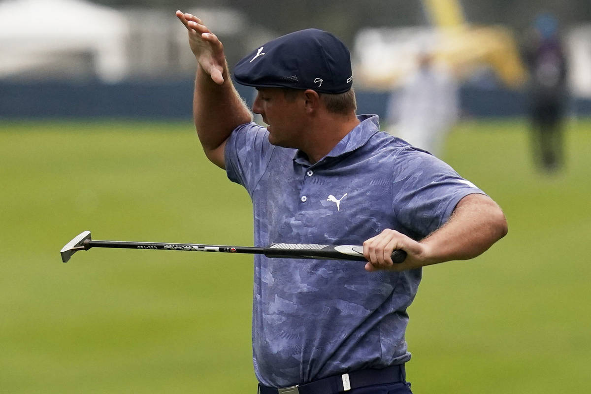 Bryson DeChambeau reacts after missing a putt on the 12th hole during the final round of the PG ...