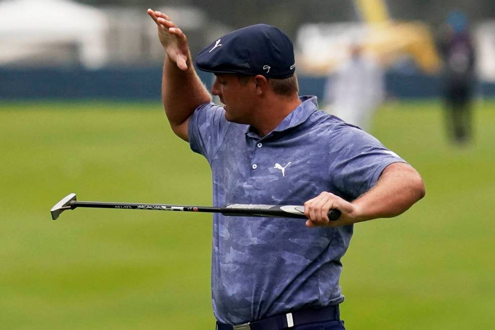 Bryson DeChambeau reacts after missing a putt on the 12th hole during the final round of the PG ...