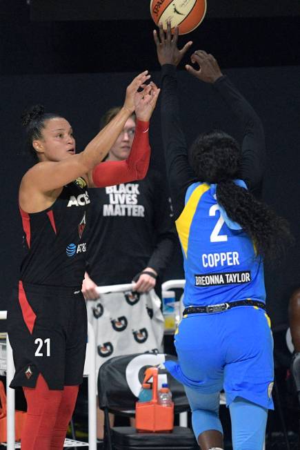 Las Vegas Aces guard Kayla McBride (21) goes up for a shot in front of Chicago Sky guard Kahlea ...